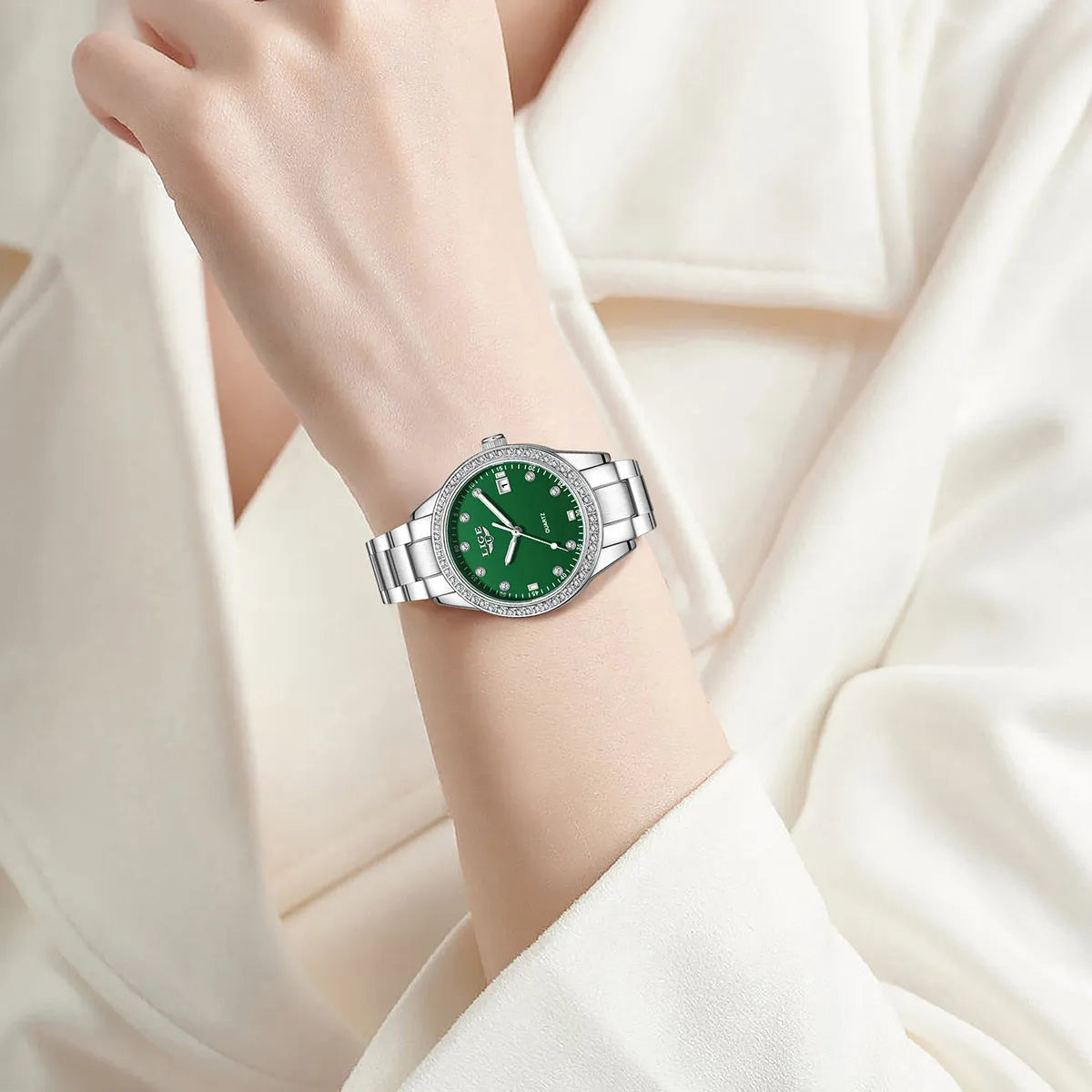 Silver fashion quartz watch with round 34mm dial, diamond markers, and stainless steel case.