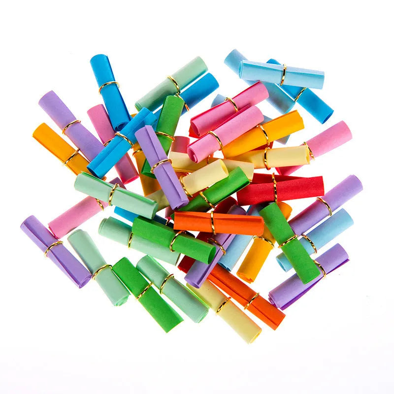 Assorted colourful mini paper scrolls with metal eyelets, shown in 3x7cm, 4x7cm and 5x5cm sizes