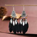 Round drop feather earrings with alloy construction and patterned design in various colour options