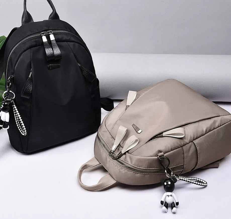 Medium Oxford cloth rucksack with multiple compartments showing mobile phone pocket and ID holder