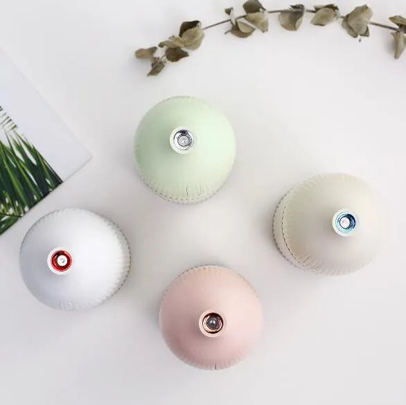 White 300ml USB aromatherapy diffuser with LED light on desk
