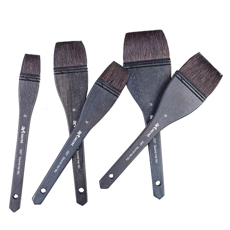 Grey squirrel hair makeup brush with a light wood handle on a plain background.