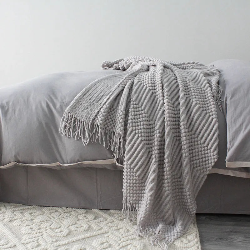 Polyester fibre small throw blanket in dark grey, khaki, or light grey, showing its 127x170cm size.