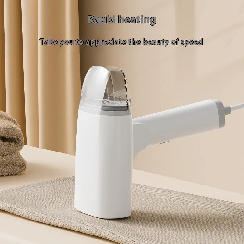Blue handheld garment steamer with water tank and temperature controls for clothes steaming