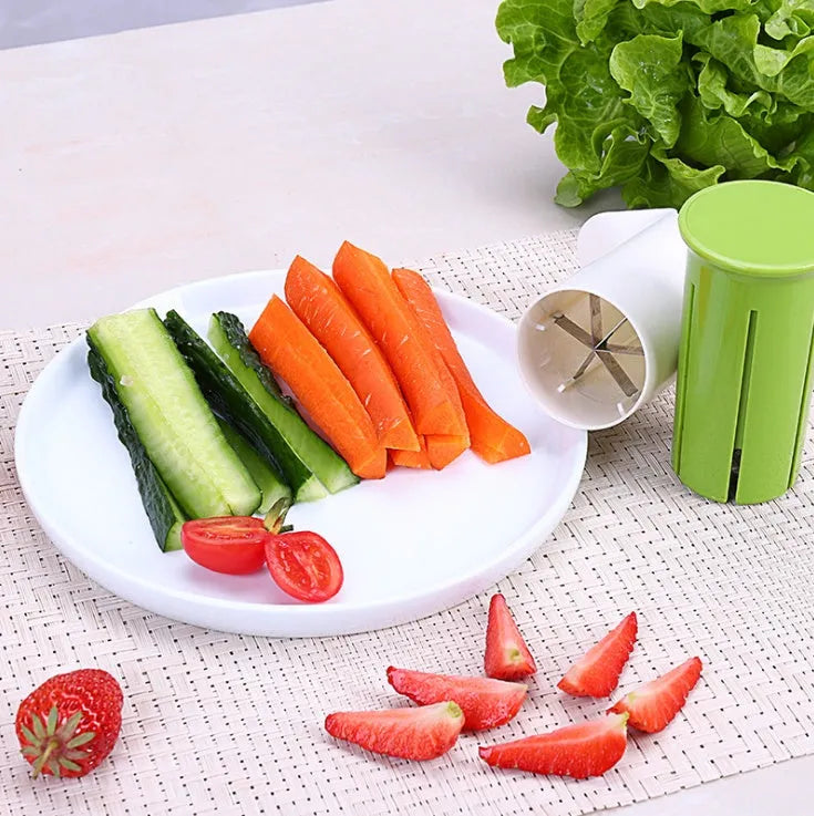 White kitchen vegetable and fruit slicer with multiple stainless steel blades.
