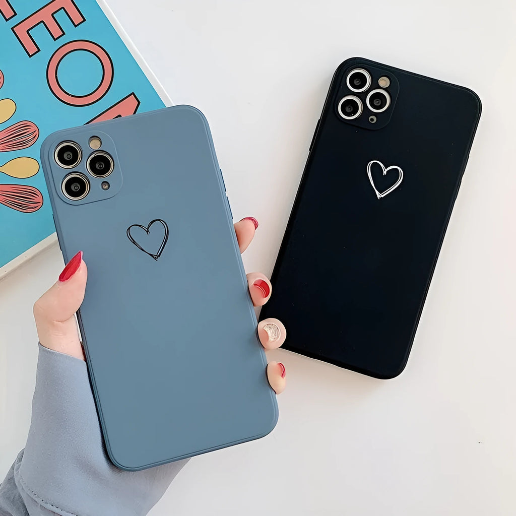 Silicone phone case for Apple iPhone in multiple solid colour options including black, pink, and purple
