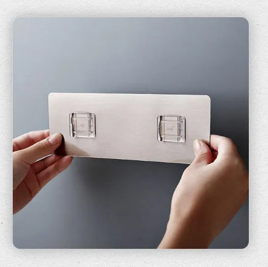 White plastic kitchen knife rack organiser with modern simple design on a countertop.
