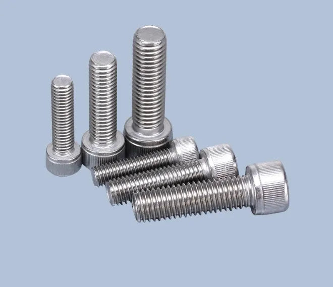 Stainless steel turntable cartridge mounting kit with allen bolts, nuts, washers, and two allen keys on a grey background.