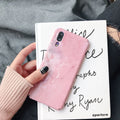 Black painted hard back phone case for Huawei models on a white background.