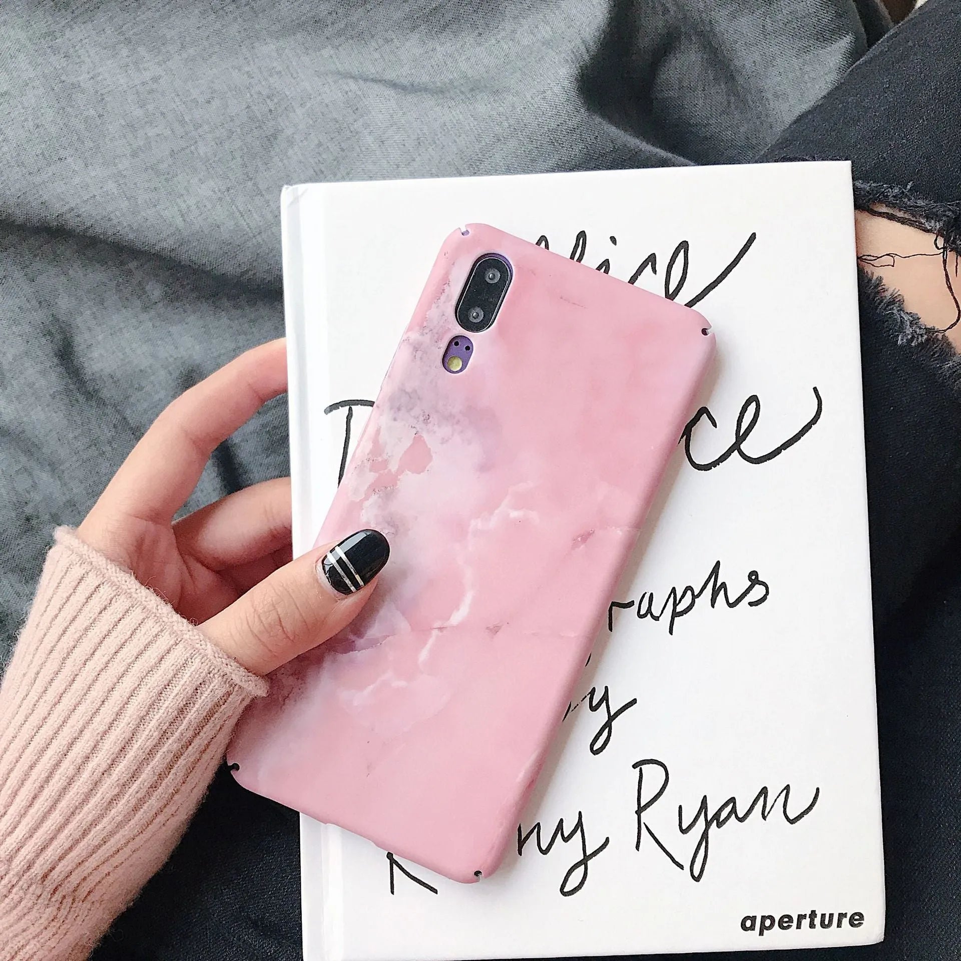 Black painted hard back phone case for Huawei models on a white background.