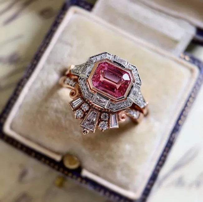 Rose gold alloy women's fashion ring with geometric shape and gemstones in a retro style.