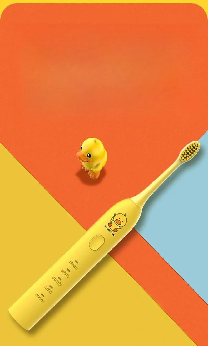 Yellow rechargeable electric toothbrush with small duck design, soft bristles, and USB charging port.