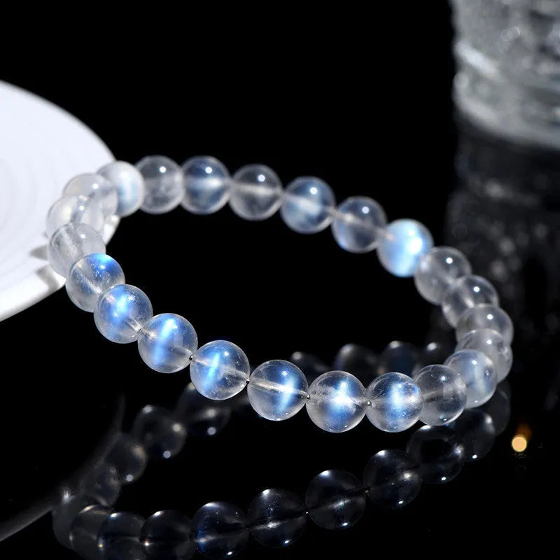 Natural cream body blue moonlight crystal bracelet on a white background showing grinding finish.