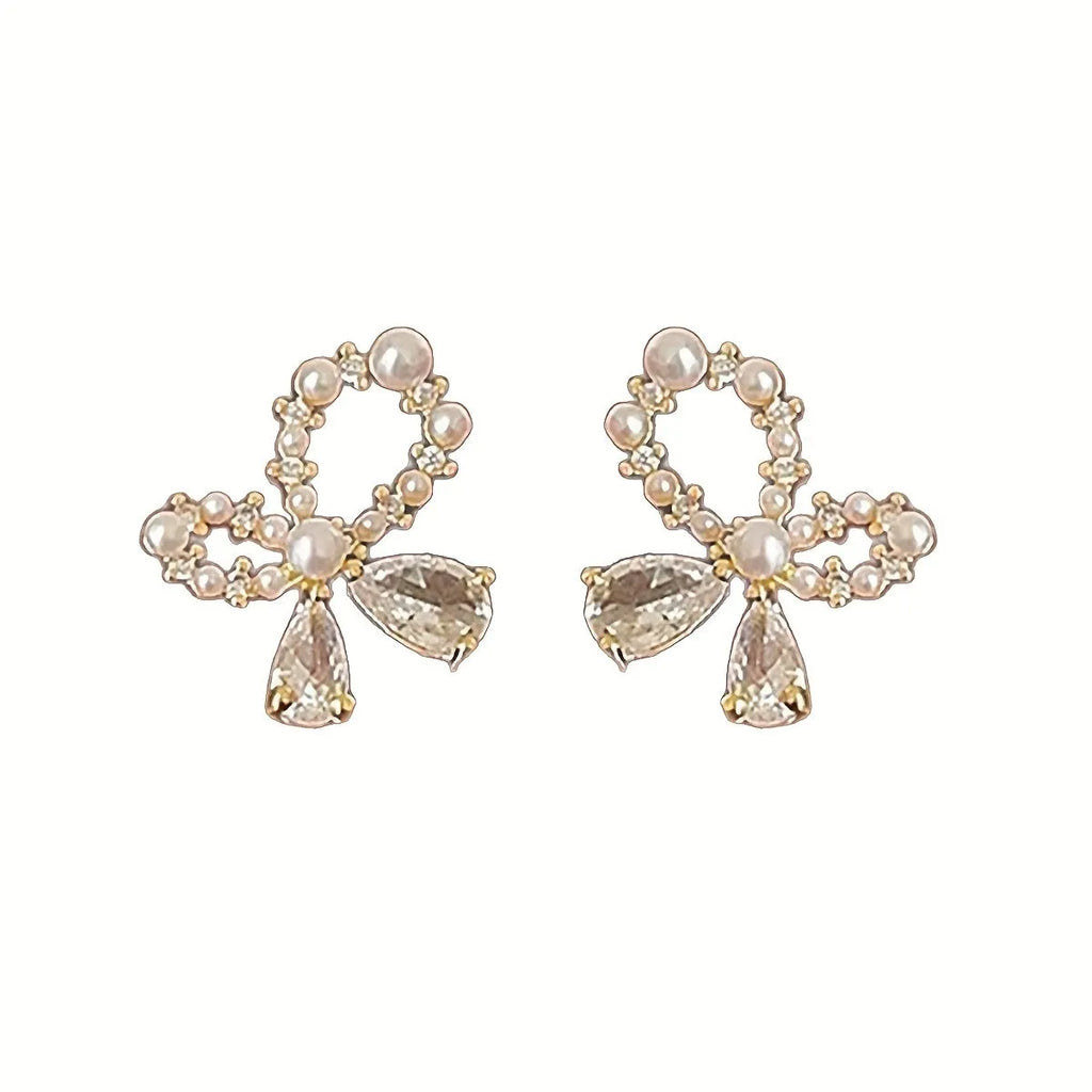 Silver electroplated copper butterfly earrings with geometric accents on a white background