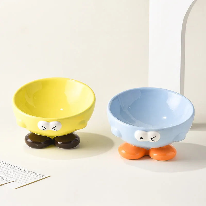 Blue oblique tall ceramic pet bowl with a cute expression design for cats and dogs.