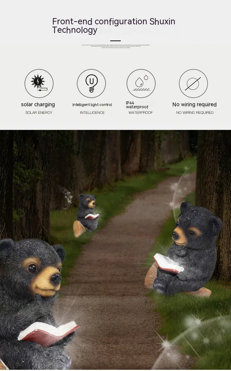 Black bear solar light ornament in synthetic resin placed in garden with solar panel on top