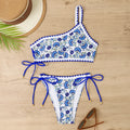 Blue one-shoulder floral bikini set with brief bottoms on mannequin