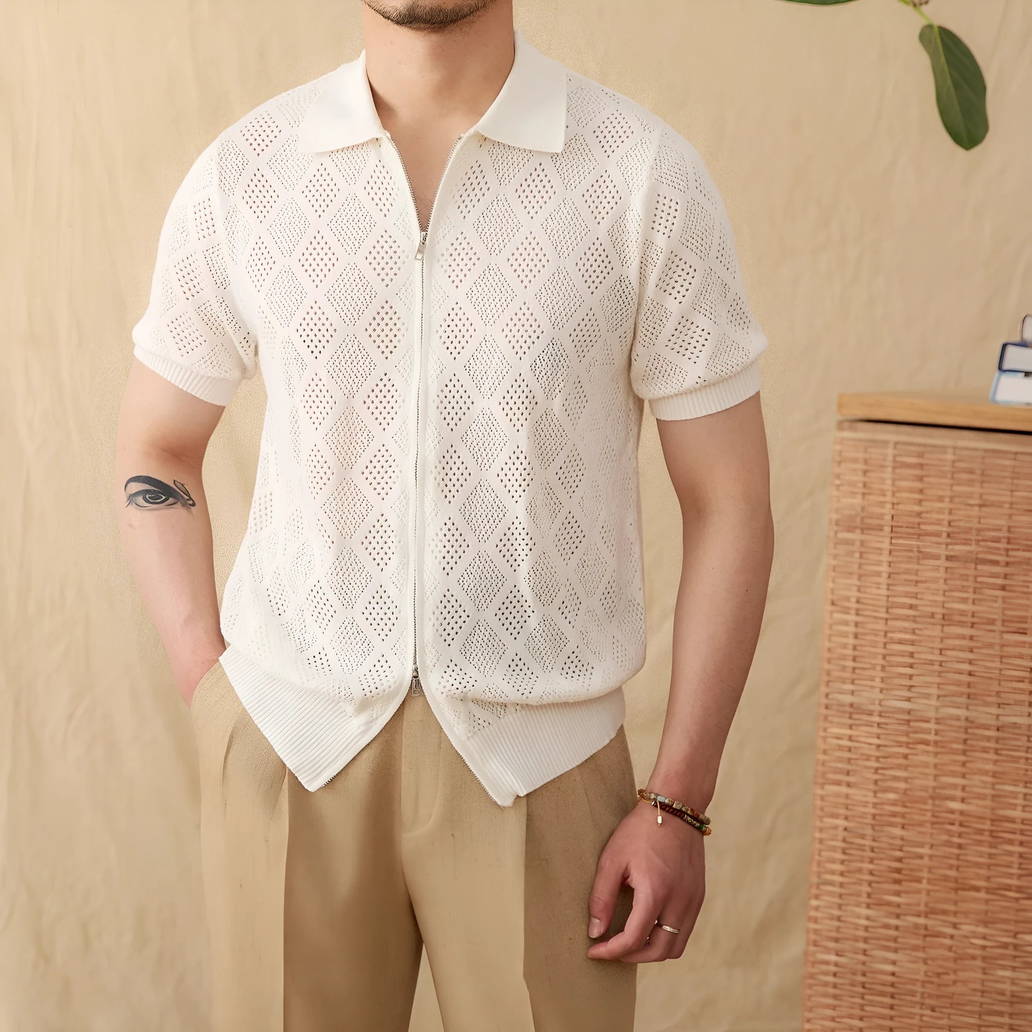 Light brown cotton short sleeve cardigan with front zipper and lapel collar laid flat.