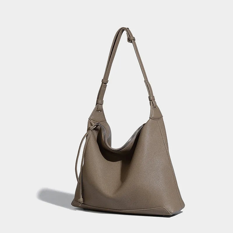 Large soft PU messenger bag in caramel colour showing 36cm length and shoulder strap