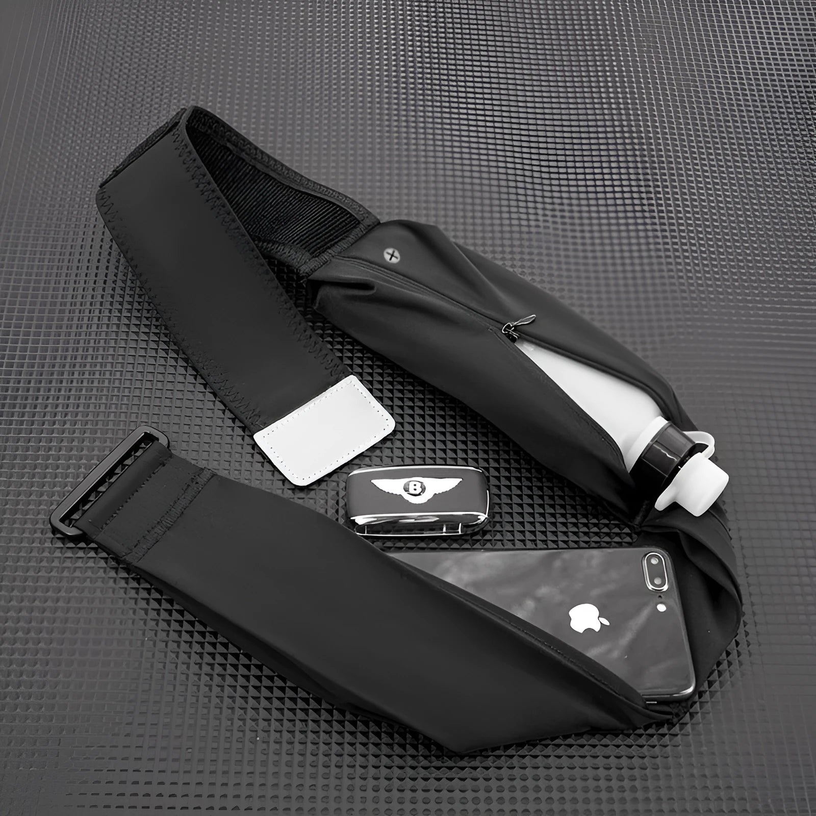 Women's running cell phone belt bag in black with 330ml kettle, adjustable waistband, nylon construction