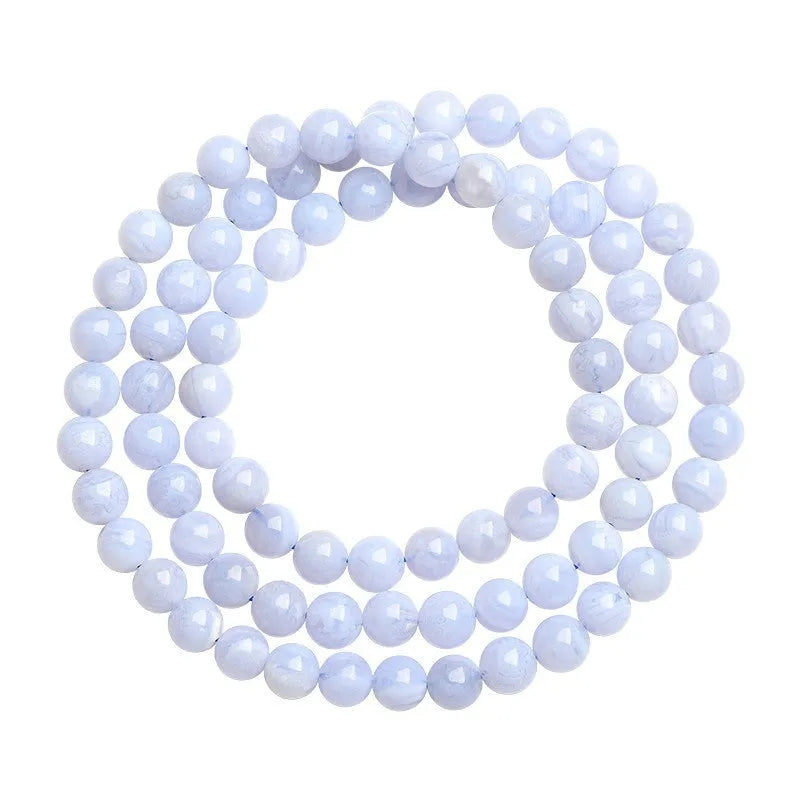Natural blue agate bracelet with multi-circle pattern and a Ruyi charm.
