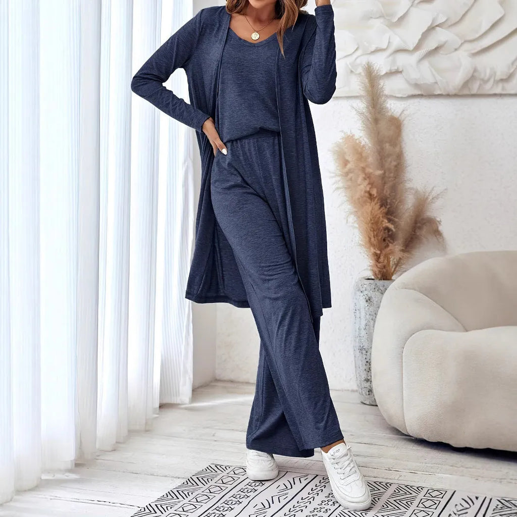 Blue women's three-piece casual suit set with sling top, cardigan, trousers, and suspenders on a hanger.