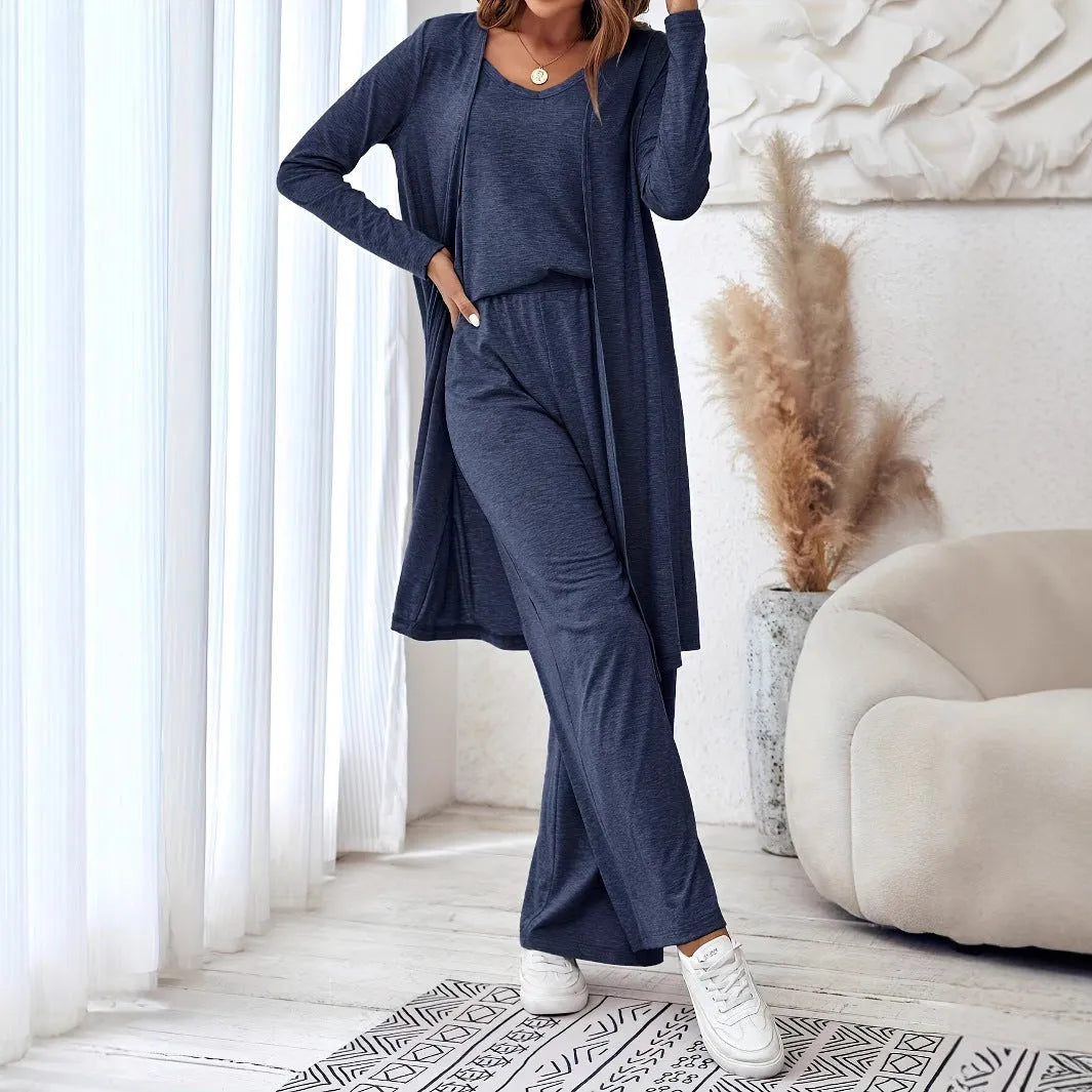 Blue women's three-piece casual suit set with sling top, cardigan, trousers, and suspenders on a hanger.