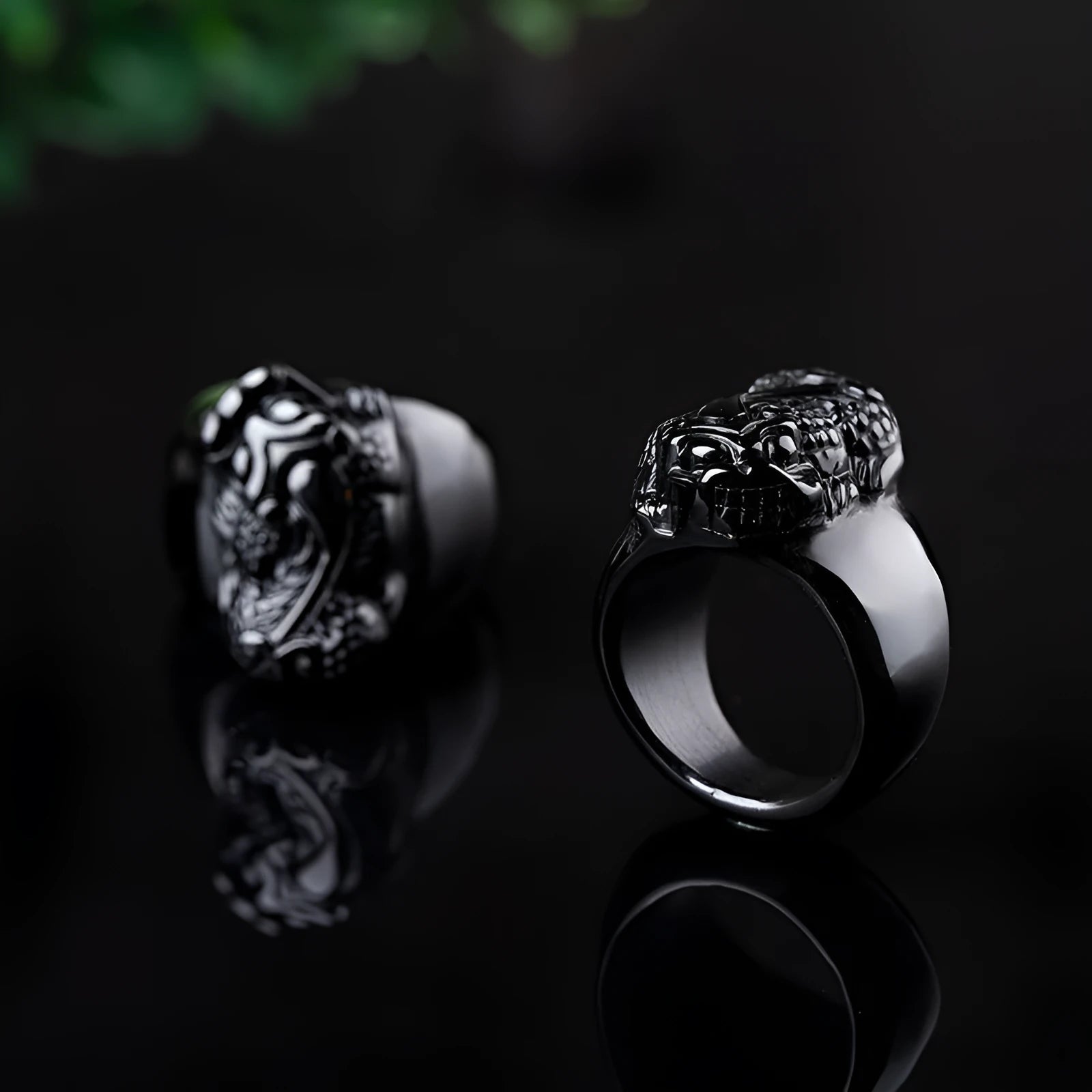 Men's chunky silver thumb ring with a black obsidian crystal showing gold sheen and a detailed Pixiu design.
