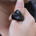 Men's chunky silver thumb ring with a black obsidian crystal showing gold sheen and a detailed Pixiu design.