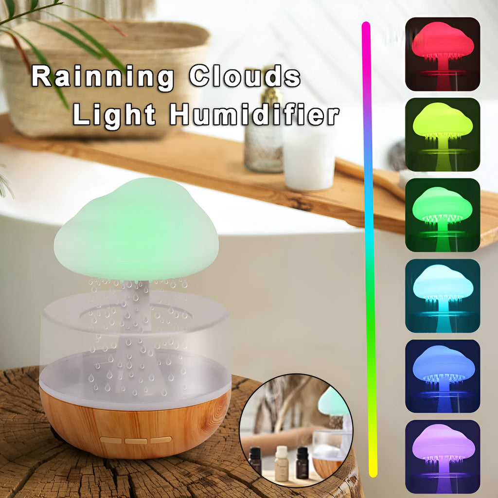 White raining cloud shaped micro humidifier with night light and essential oil diffuser on desk