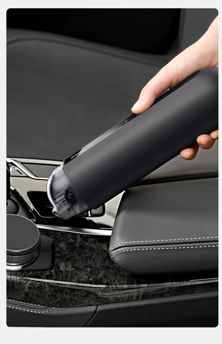 Baseus handheld cordless car vacuum cleaner in black, white, or green with blowing hose accessory.