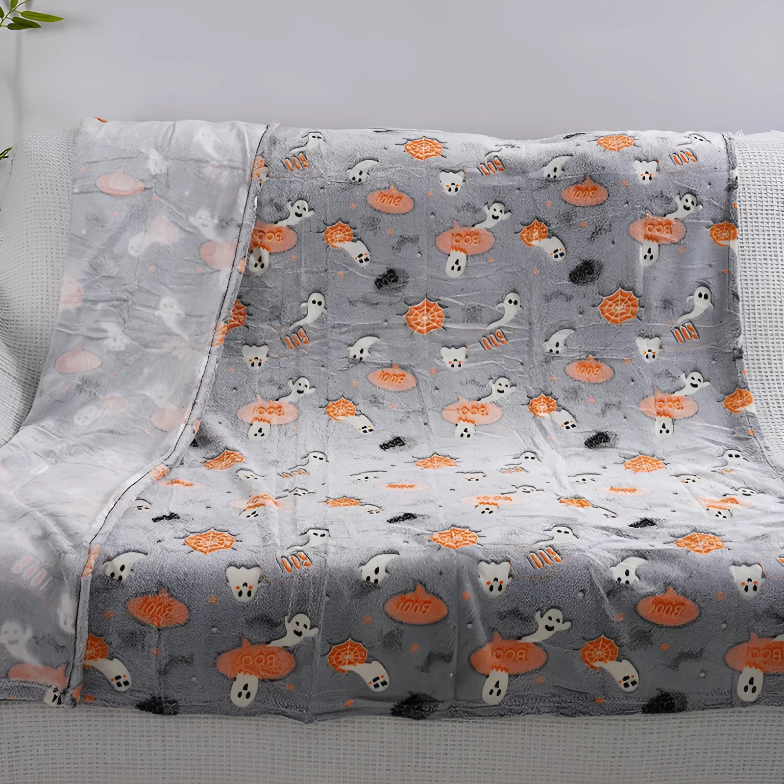 Cartoon-print flannel blanket shown in two sizes for child use or as an air conditioner cover.