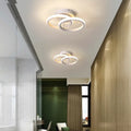 Commercial corridor aisle lights in three styles: black double semicircle, white double circle, white bipartite