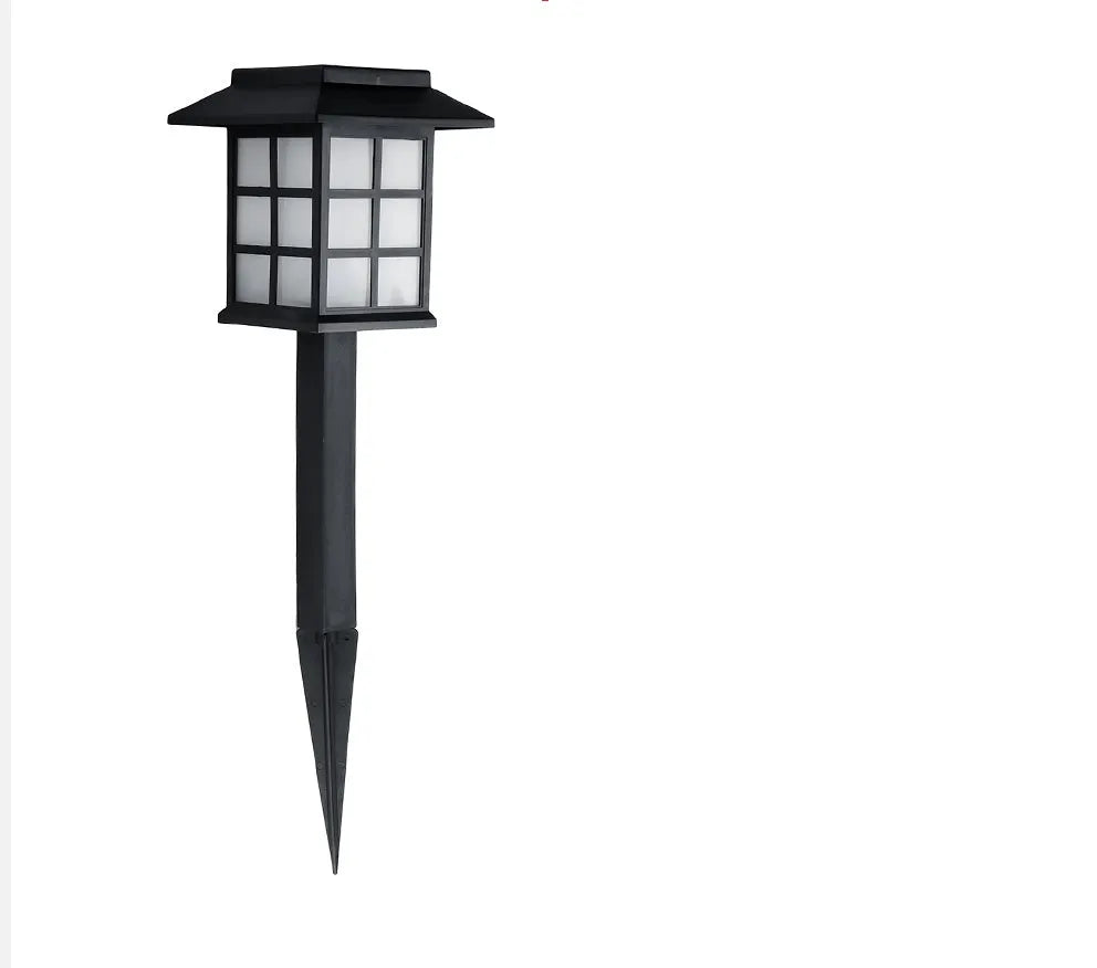 Black solar outdoor LED lawn light with window-style design for garden and pathway illumination