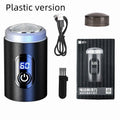 Black USB rechargeable mini shaver with cleaning brush and cable on a white background.