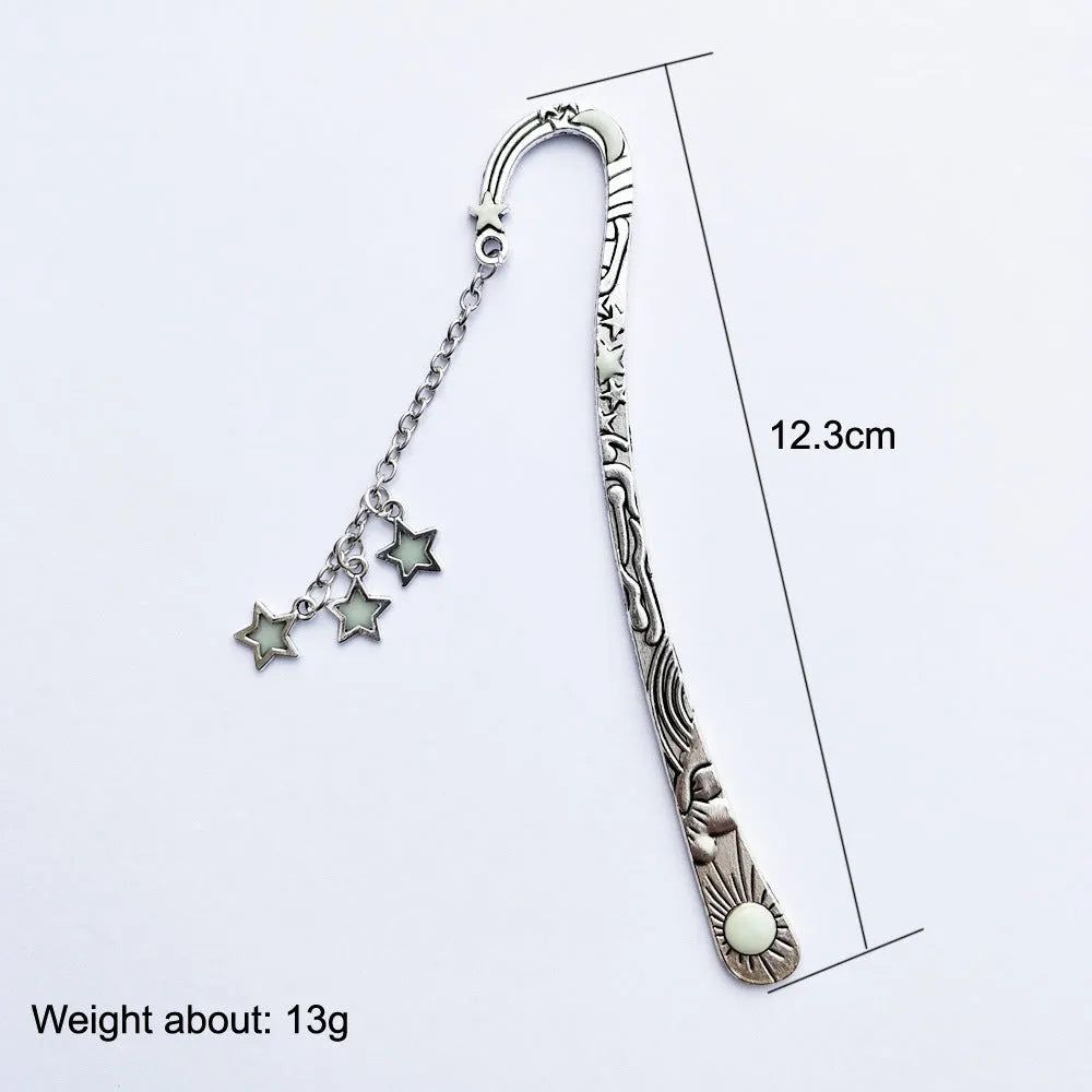 Retro five-pointed star metal bookmark glowing with celestial sun moon stars design