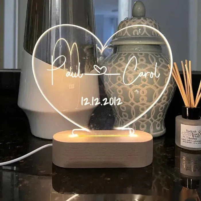 Custom transparent acrylic night light with LED base showing personalised text