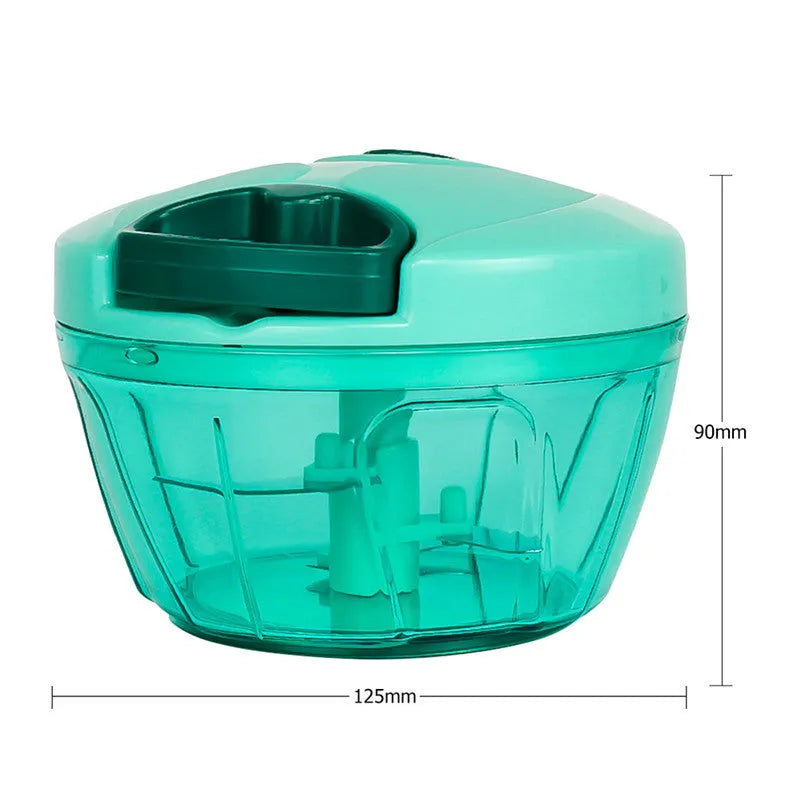 Green manual kitchen chopper with lid, showing stainless steel blades inside, on a countertop.