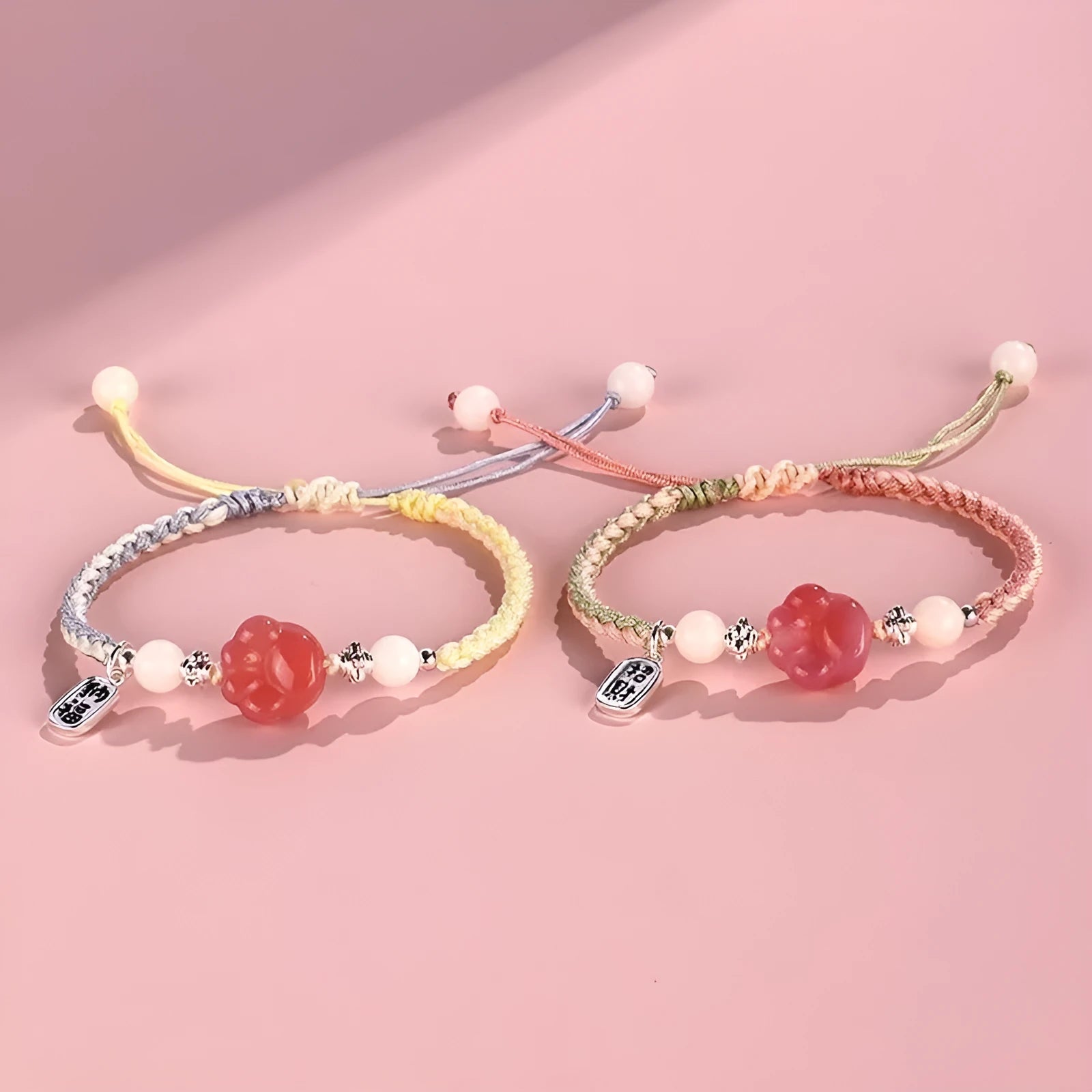 Handmade red cat's paw charm bracelet with woven band in pink or yellow colour for couples