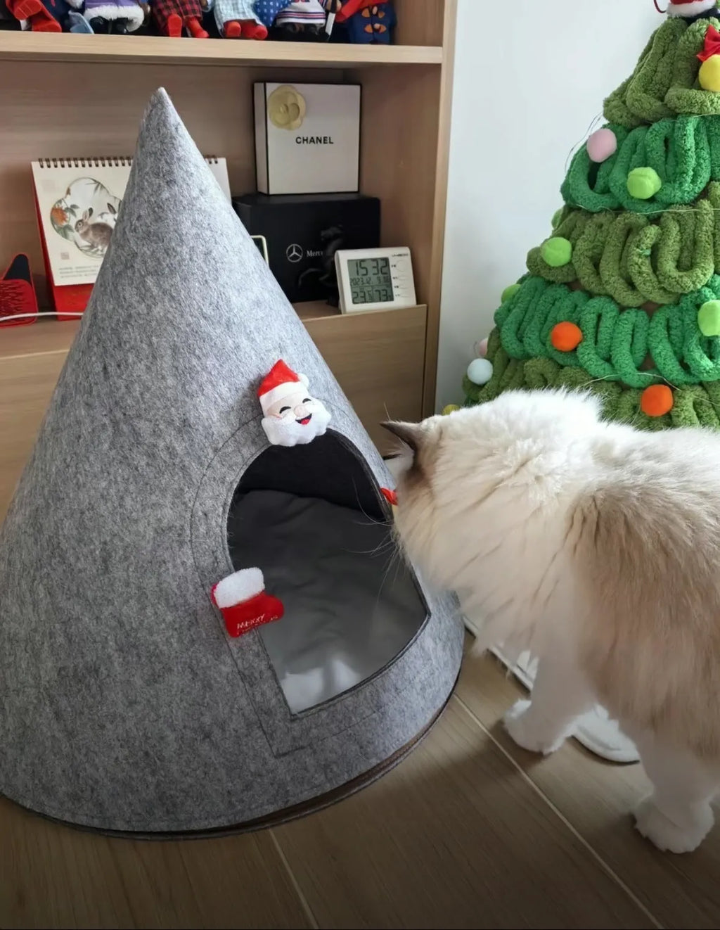 Grey handmade felt cone-shaped cat house with enclosed tent-style design