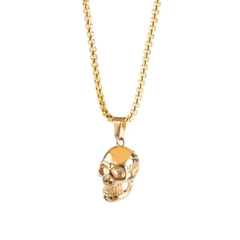 Halloween skull necklace in alloy and stainless steel with gold colour option on a black background
