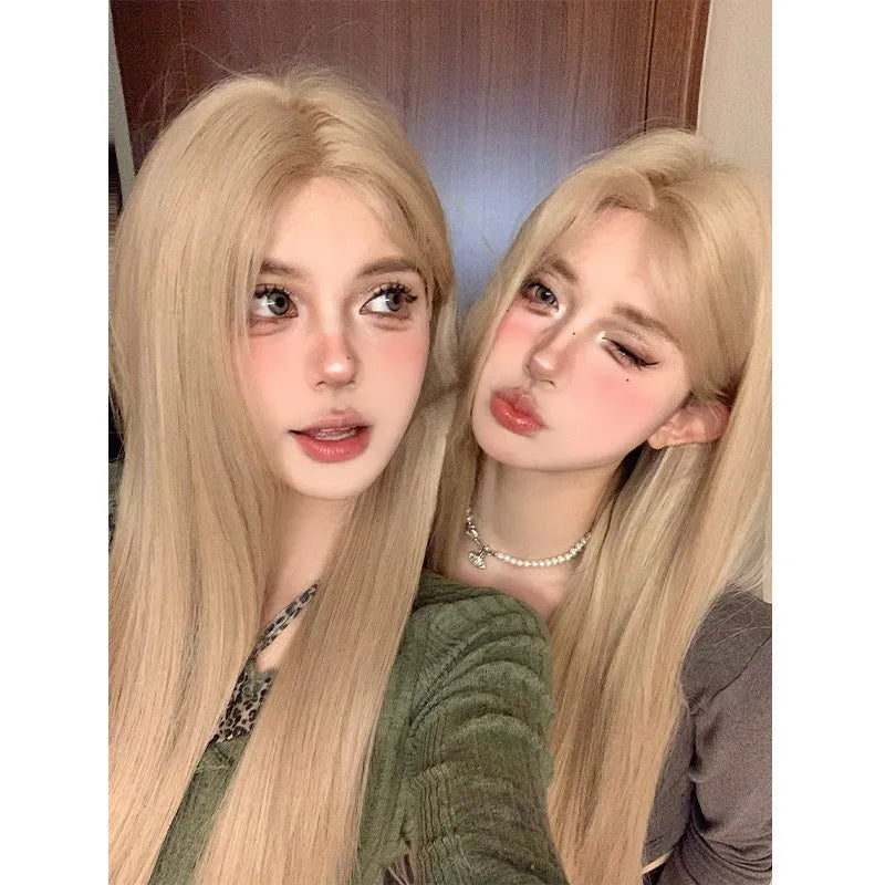 Women's long straight milk tea blonde gold wig with hair net on display