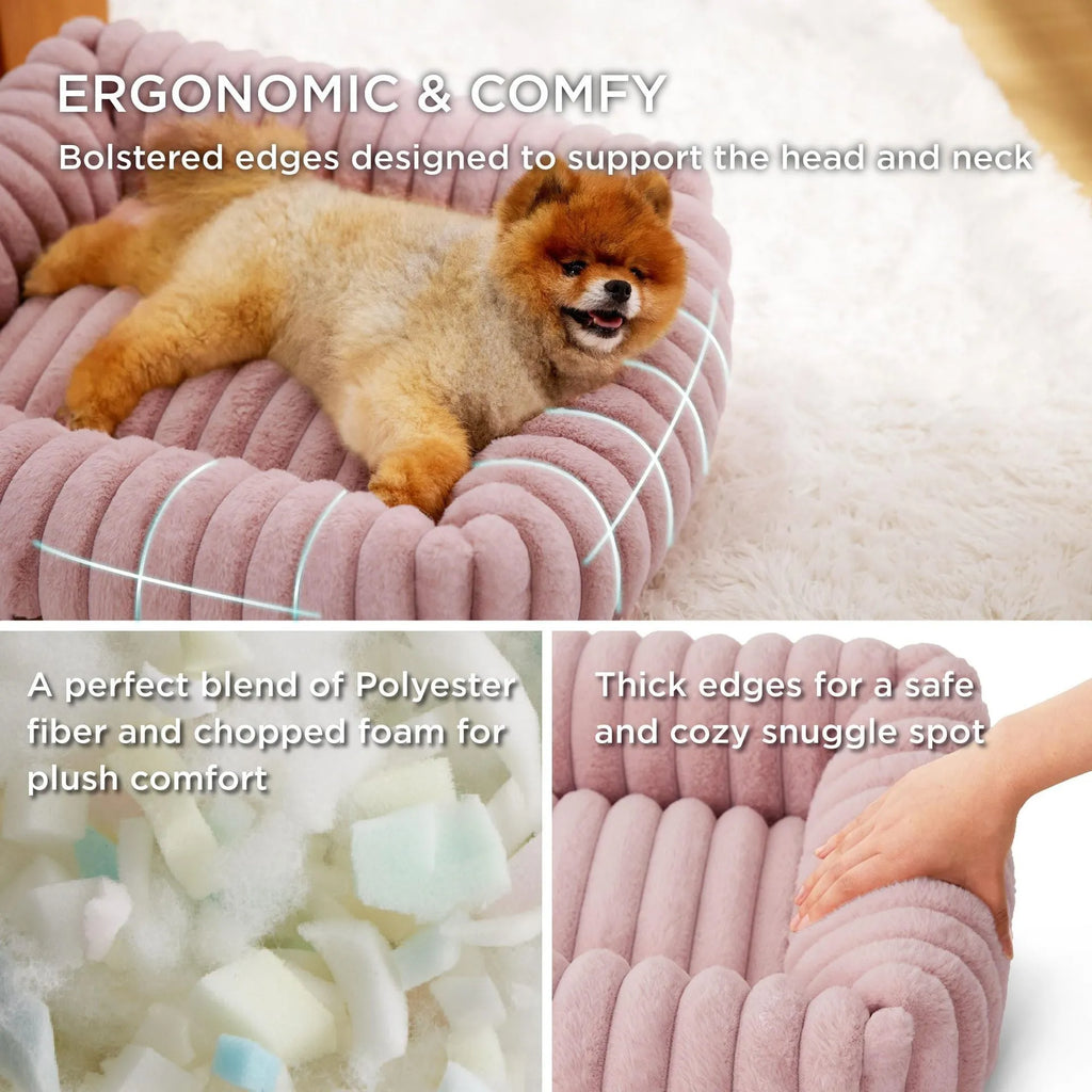 Grey pet bed with raised cushioned sides for a cat or dog.