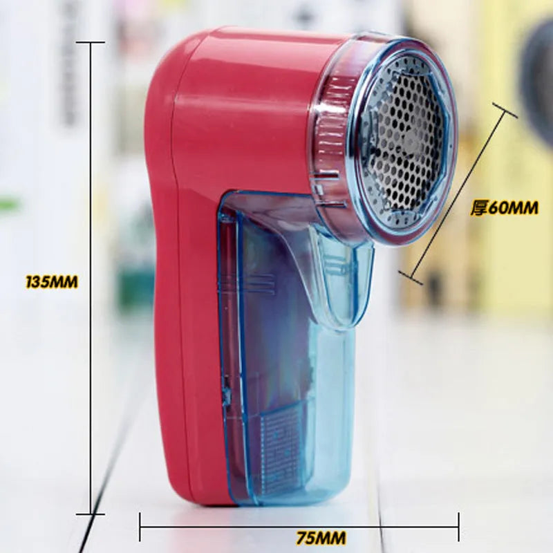 Portable electric clothing lint remover device on a white background