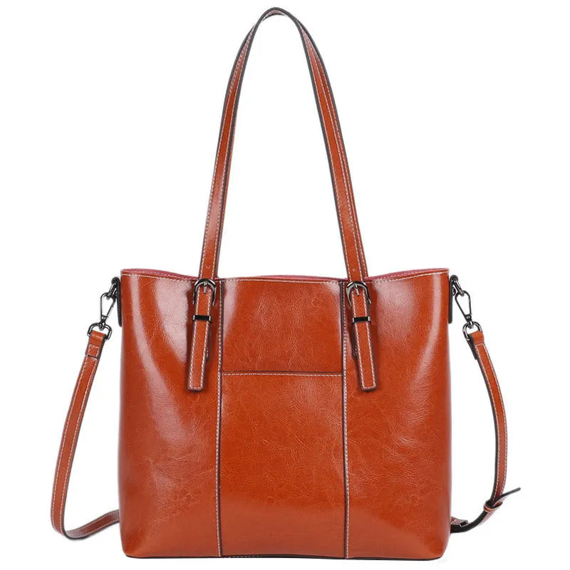 Brown genuine leather retro women's shoulder bag with three straps showing interior organisation compartments