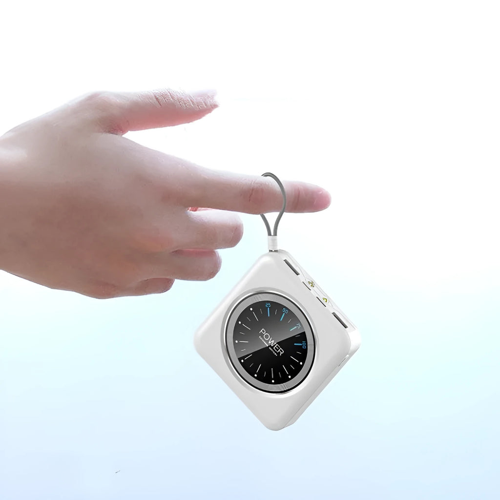 Mini clock charger in alloy case showing multi-U ports, displayed next to a coin for scale
