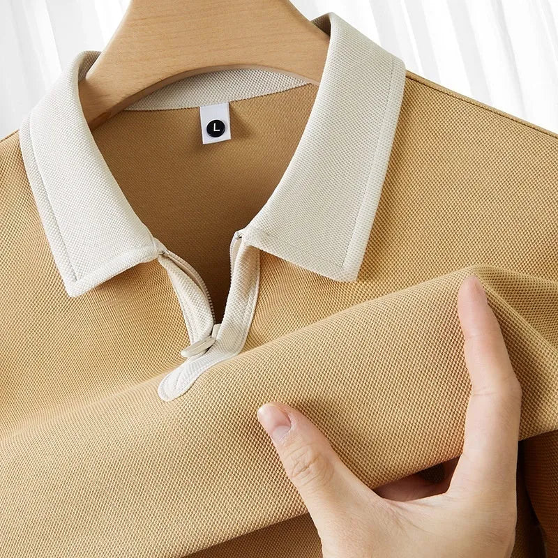 Men's navy blue zipper polo shirt with a lapel collar, shown in a loose fit with short sleeves.