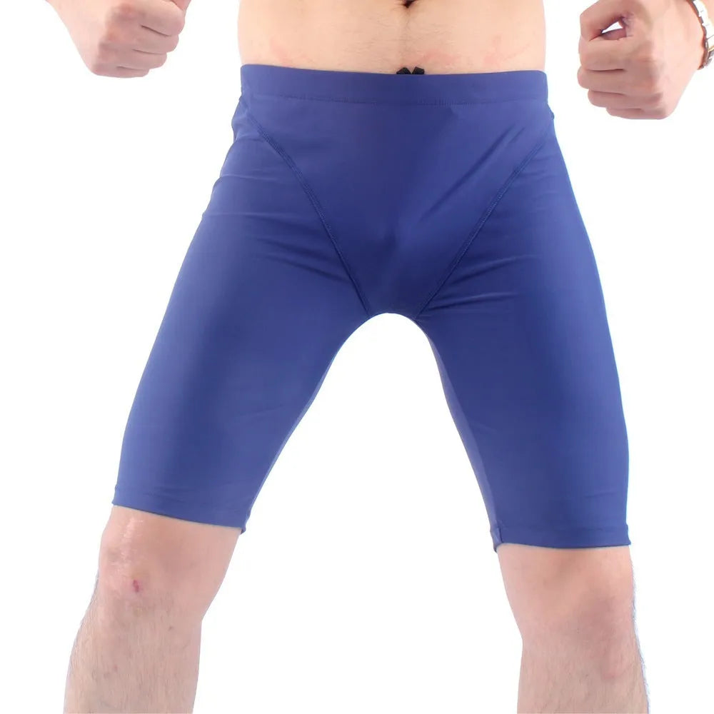 Men's loose five-point swimming trunks in green or navy blue, quick-drying nylon construction with polyester lining