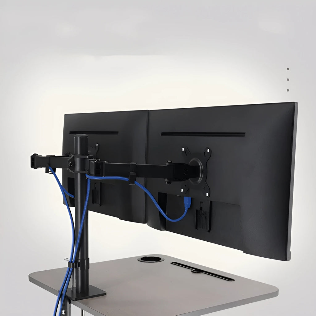 Silver and black lifting rotating computer monitor bracket on a desk