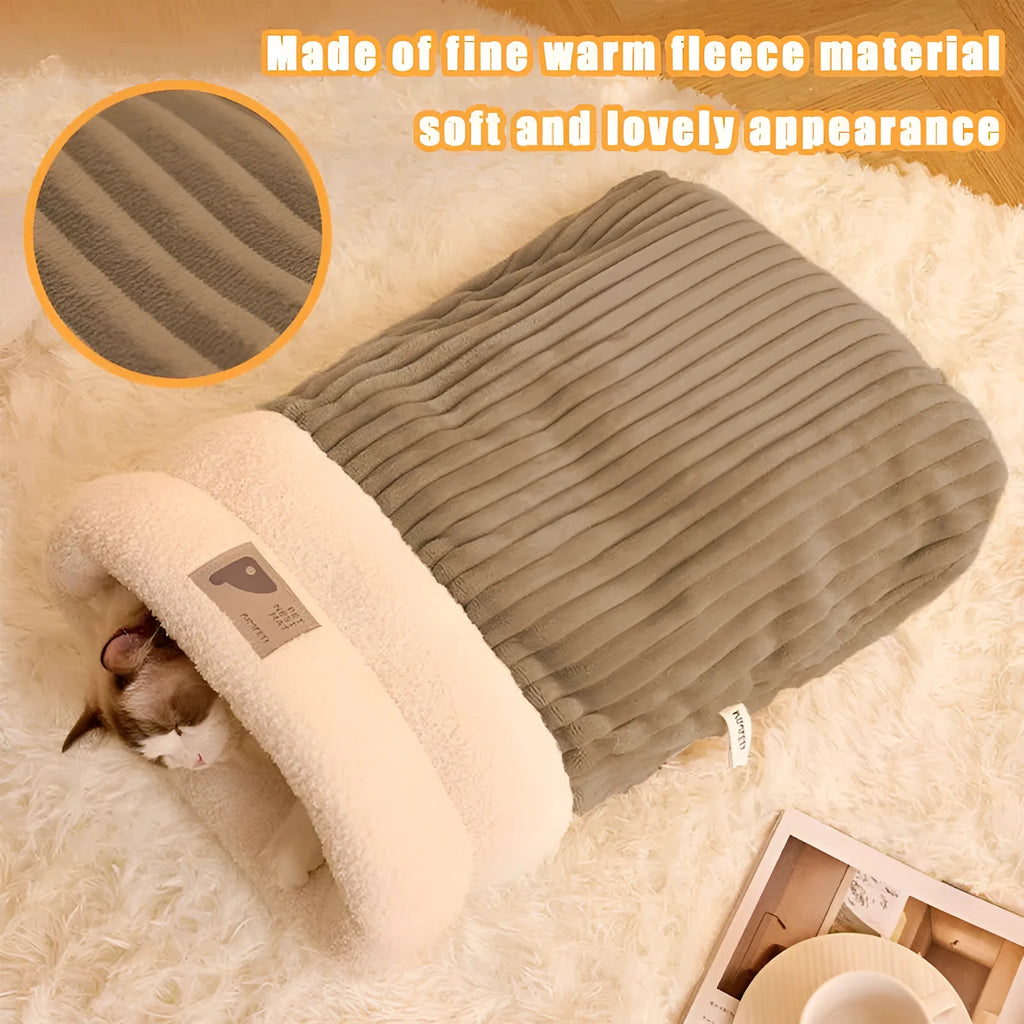Brown semi-enclosed pet sleeping bag with plush lining on a wooden floor.